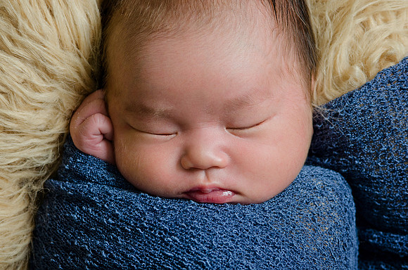 Top View Close-Up of Newborn Baby Boy Face